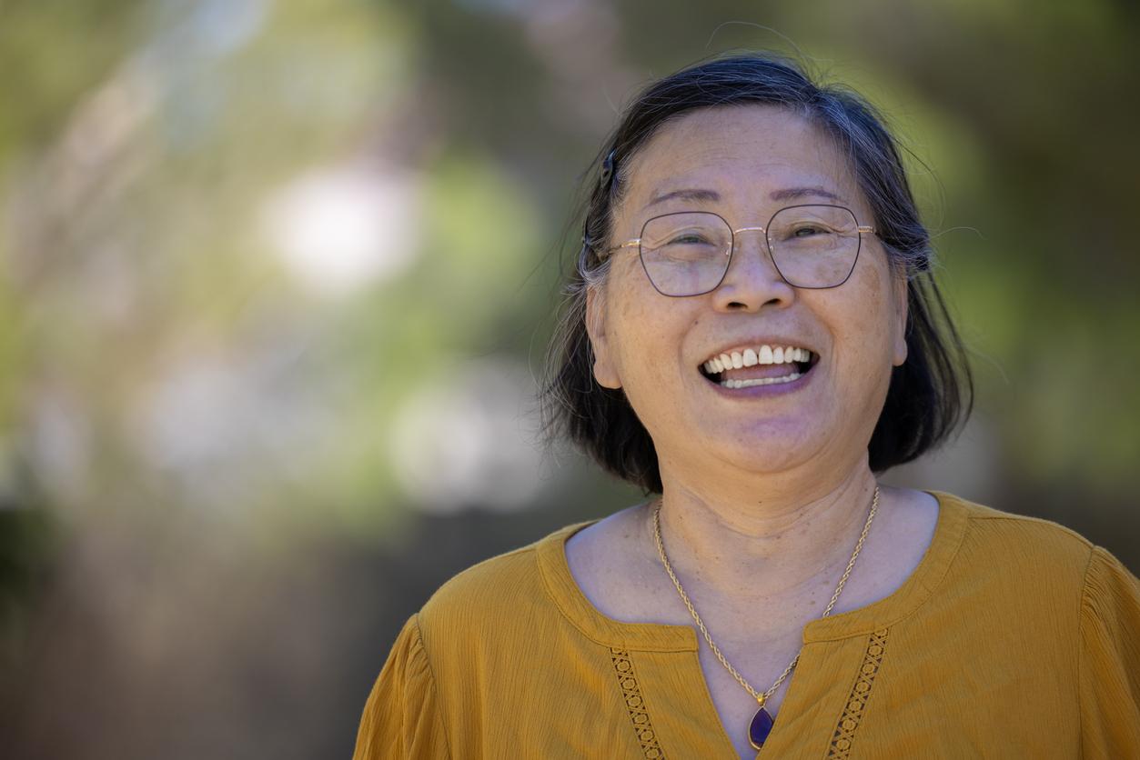 Smiling middle-aged Asian woman.