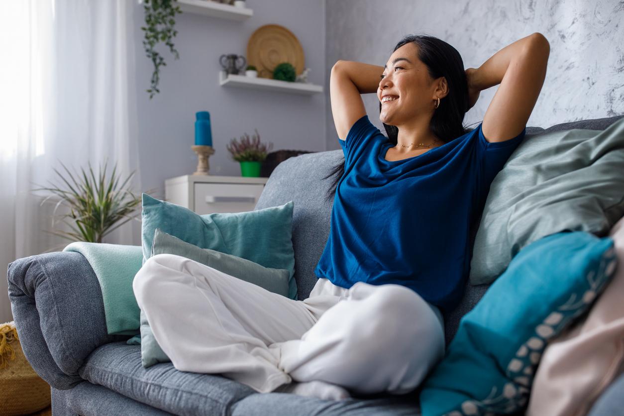 Relieved woman on couch